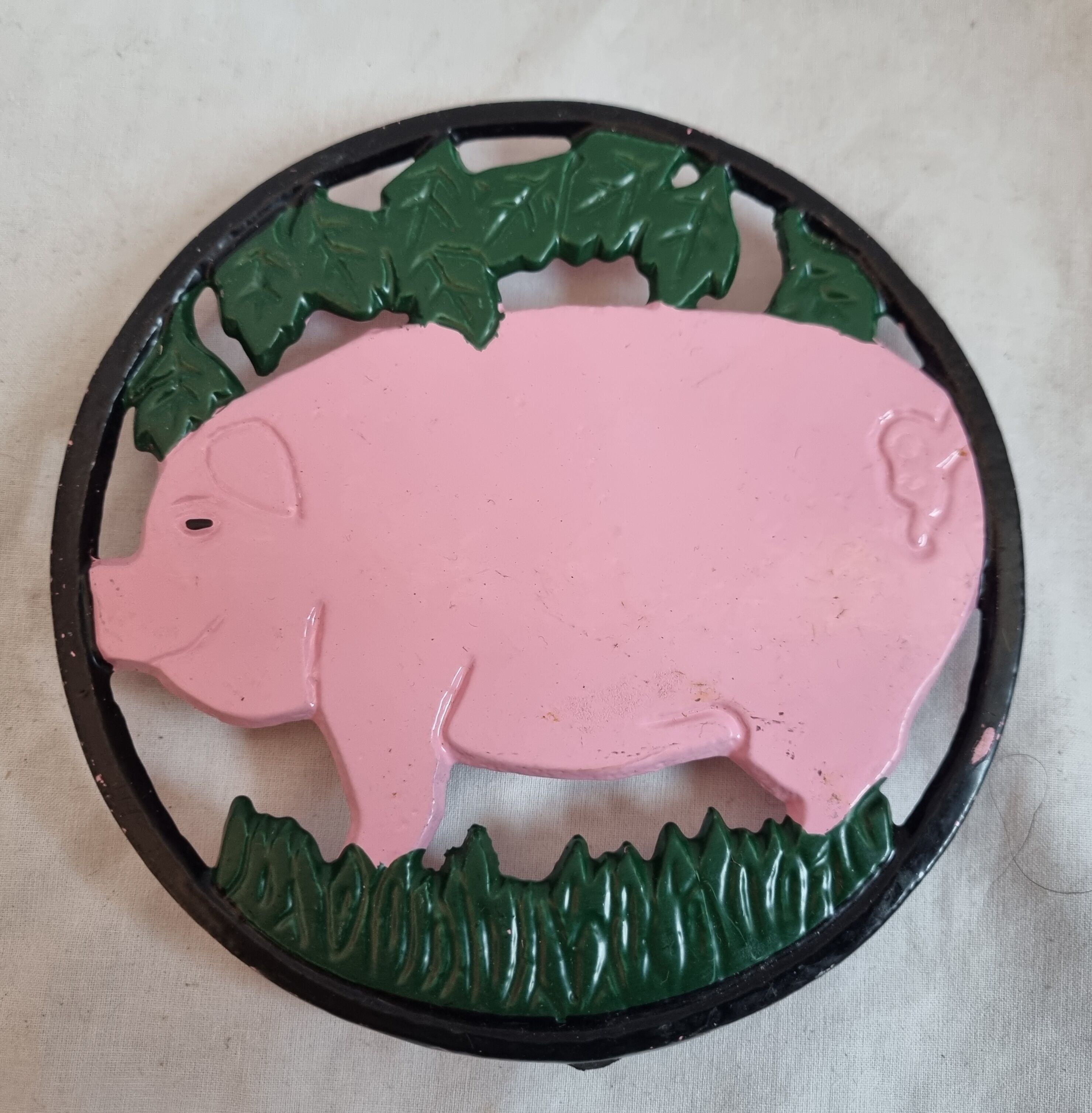 Cast iron underside, pink pig