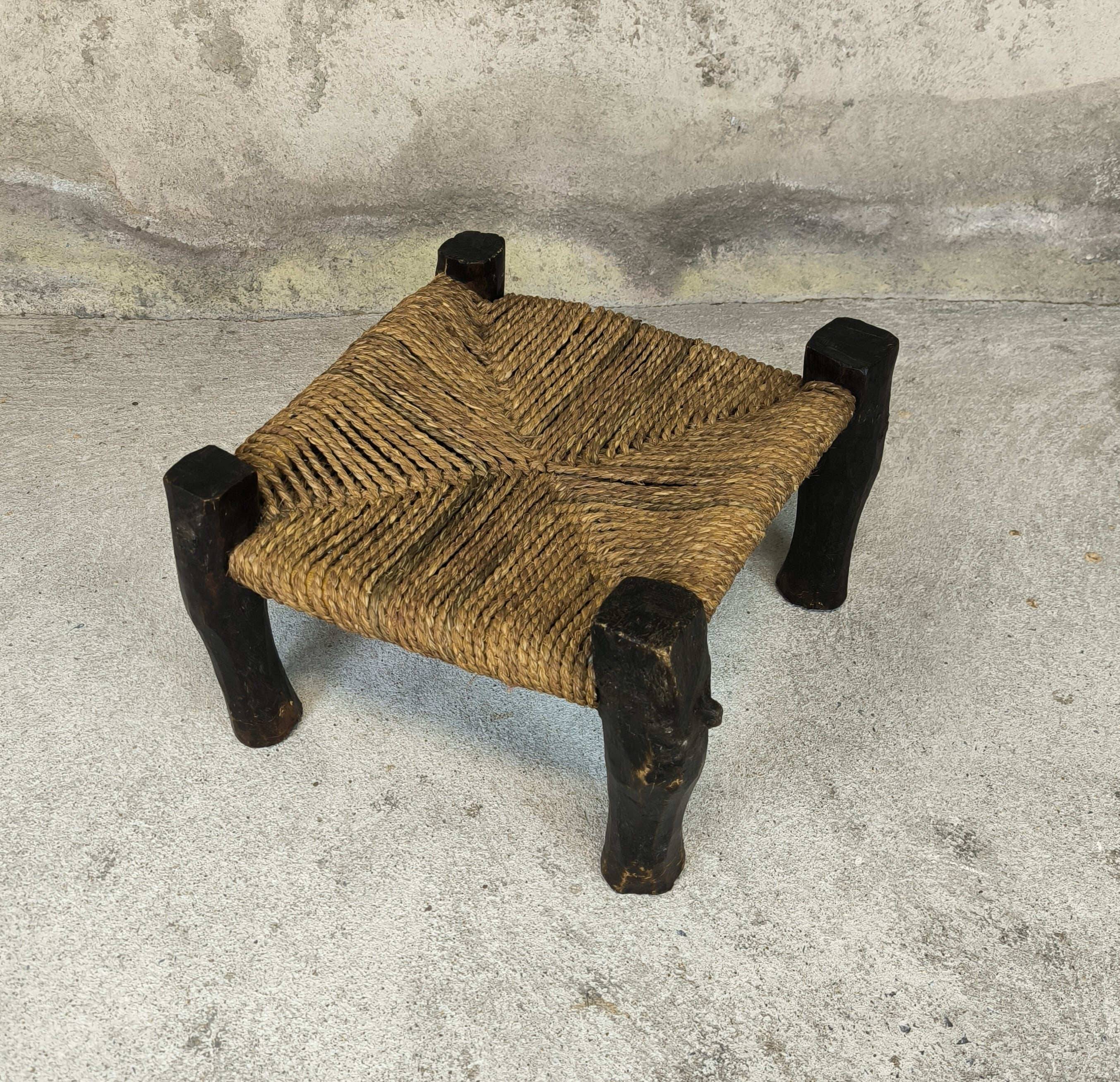 Vintage low stool in wood and straw.