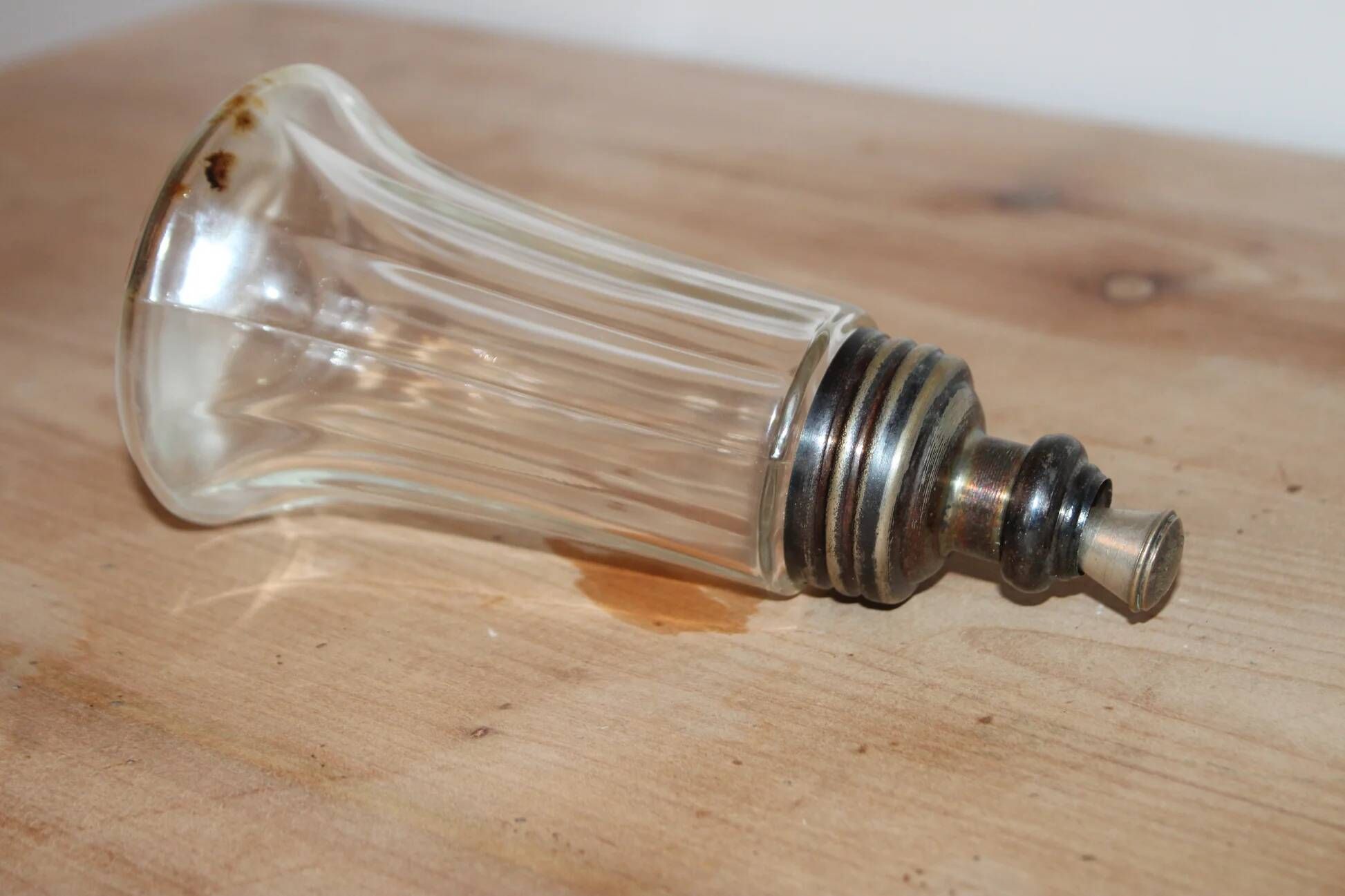 Vintage striped glass and patinated metal oil serving utensil.