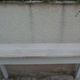 Console with a weathered grey cotton base, top in bleached walnut.