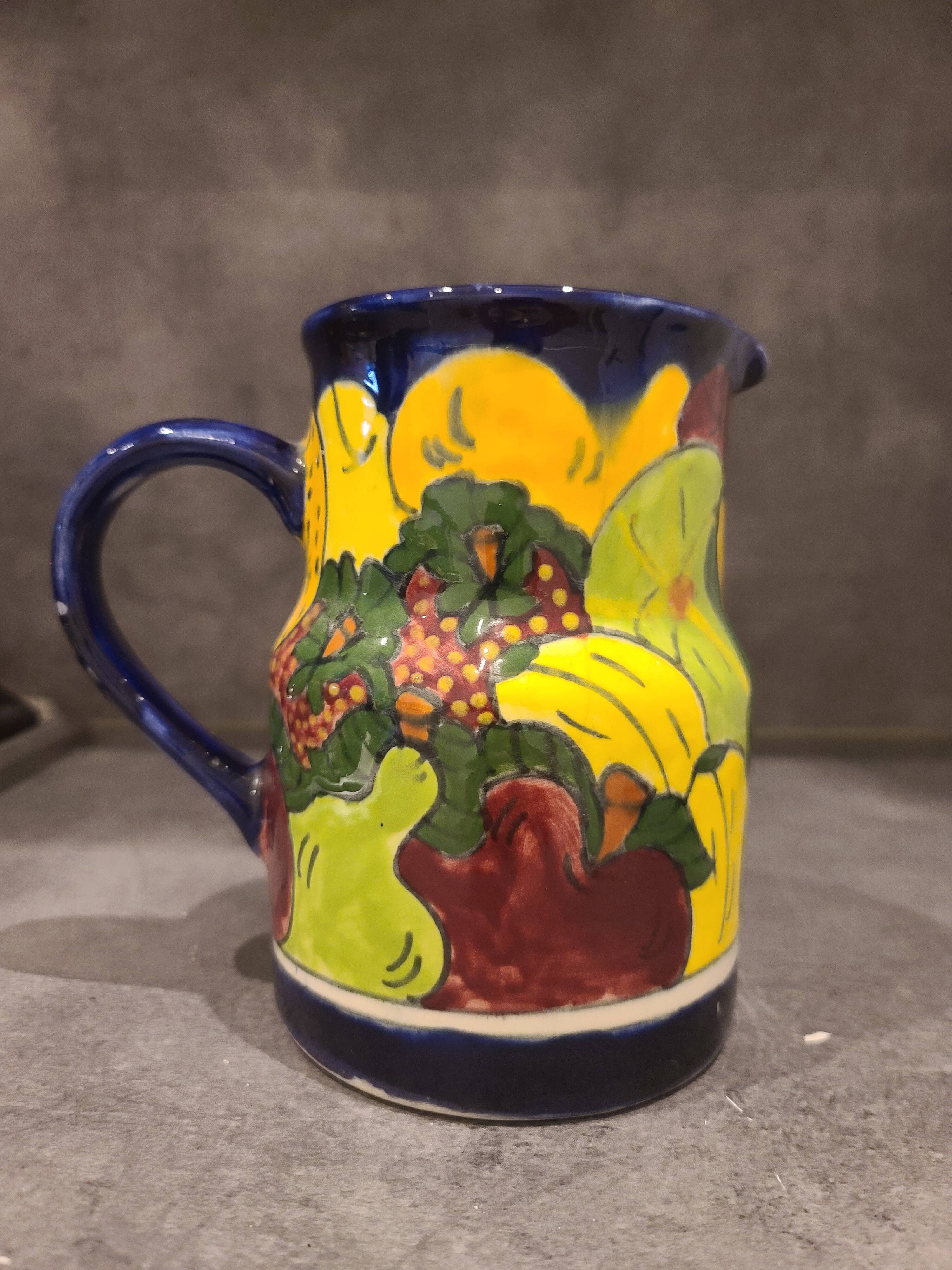Ceramic pitcher with fruit and vine decoration - colorful rustic style