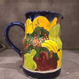 Ceramic pitcher with fruit and vine decoration - colorful rustic style