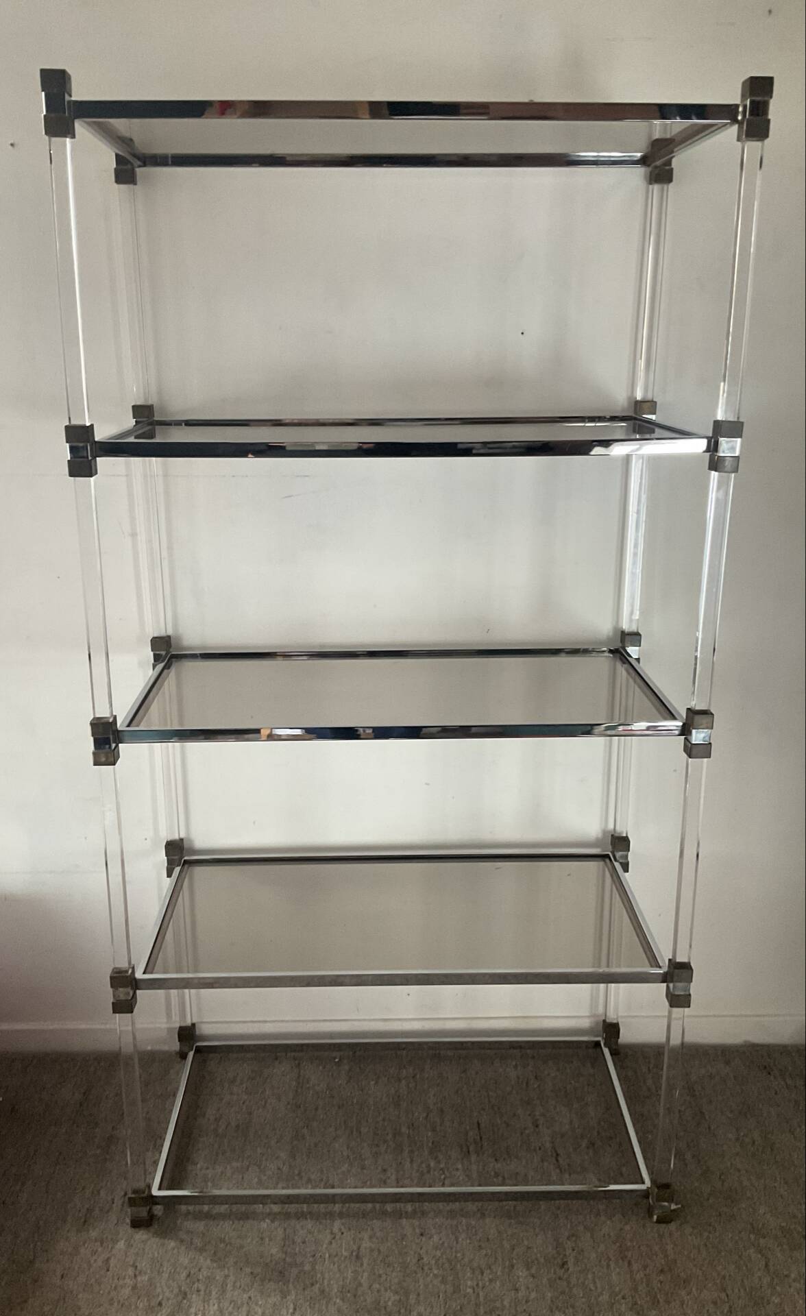 Vintage shelf in lucite, brass, and smoked glass from the 1970s.