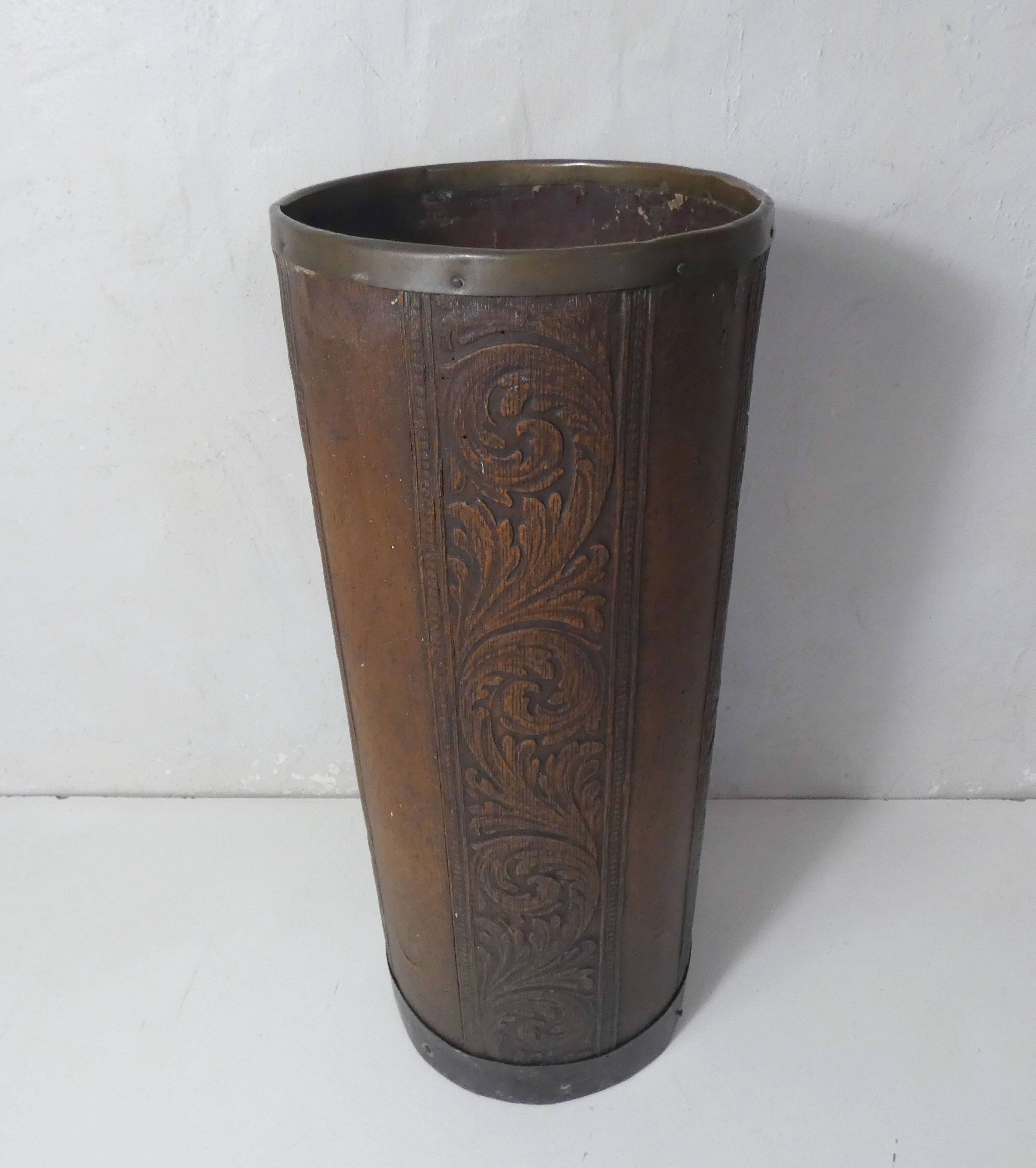 old carved wooden umbrella stand