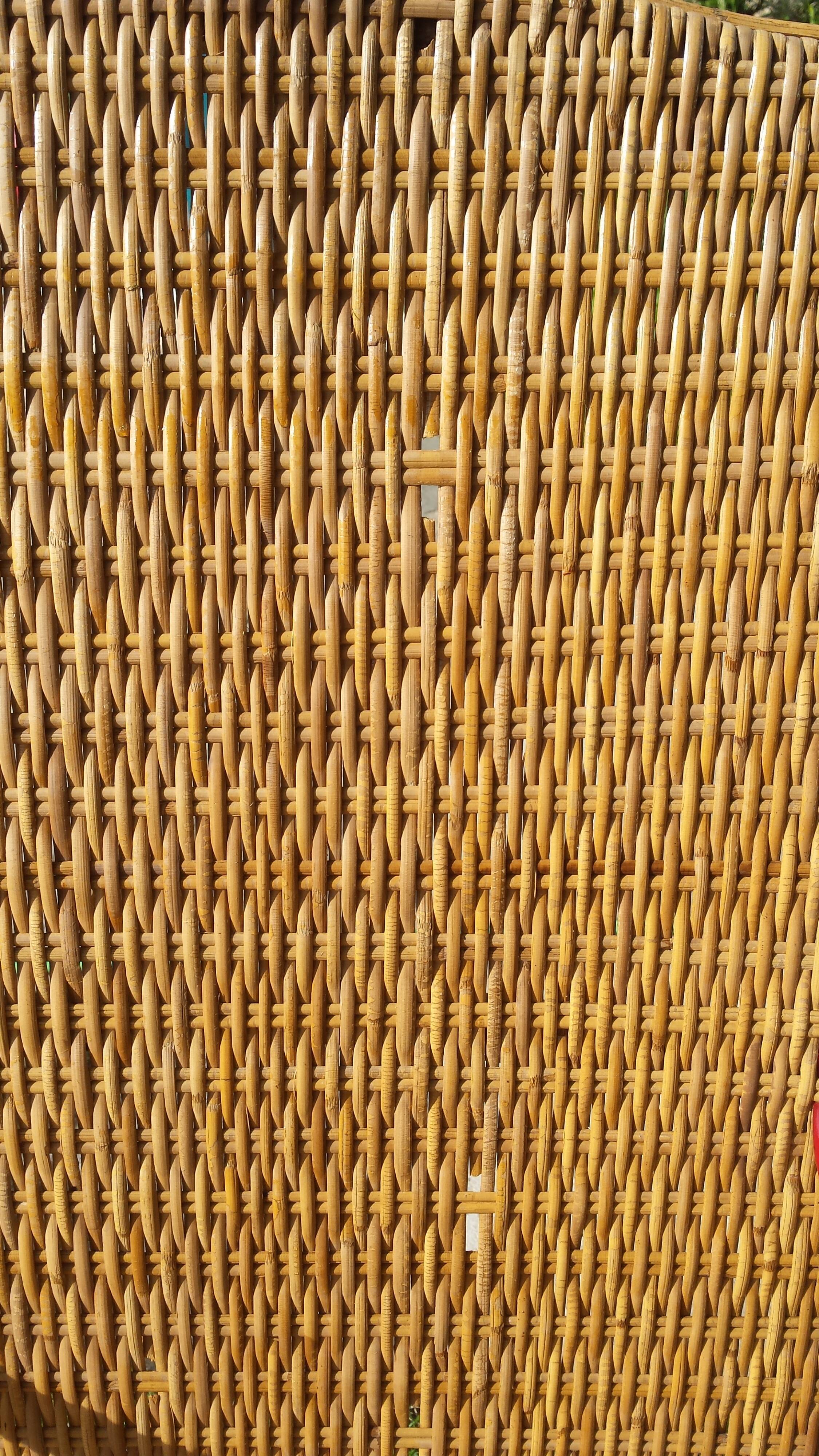 Wicker or rattan armchairs and bamboo