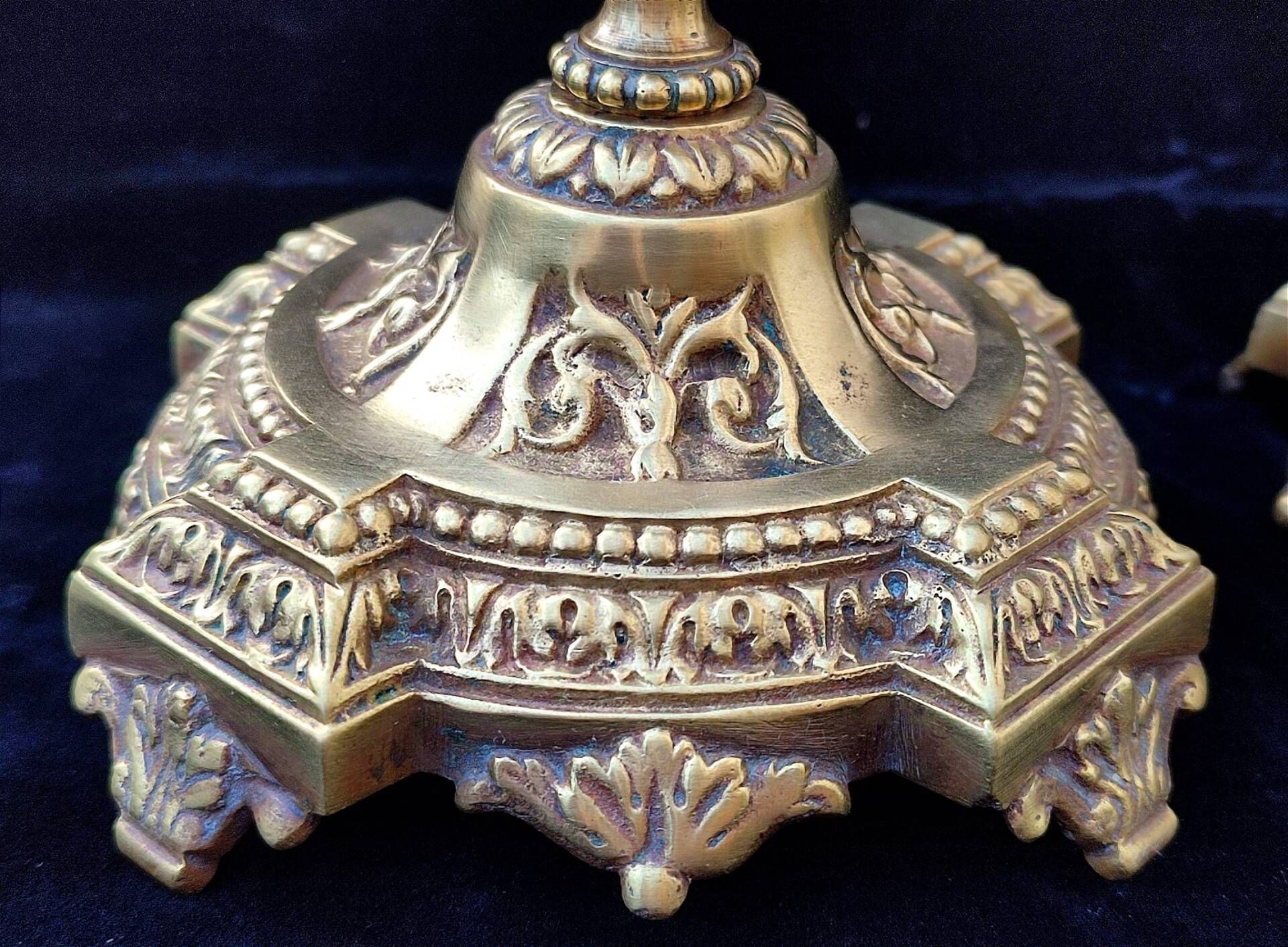 Pair of antique carved bronze candlesticks.