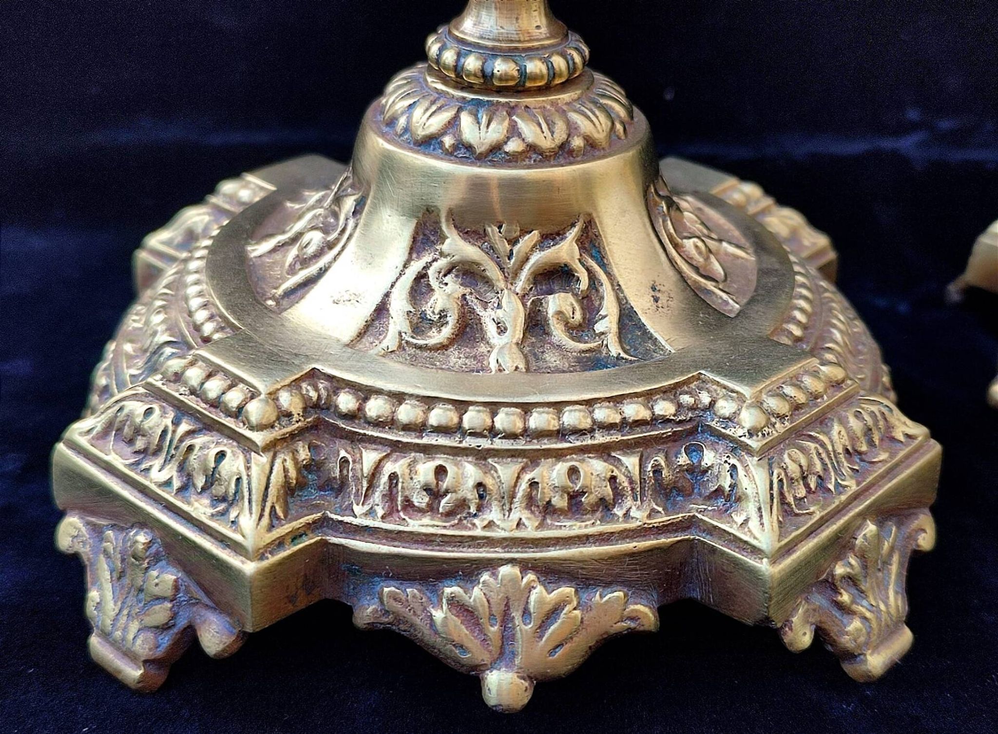 Pair of antique carved bronze candlesticks.