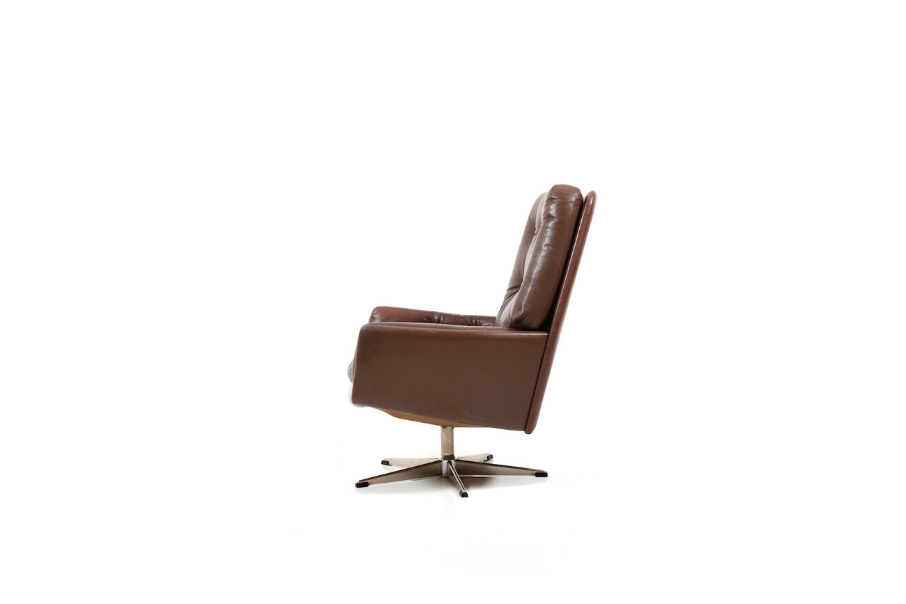 Danish swivel lounge chair in brown leather