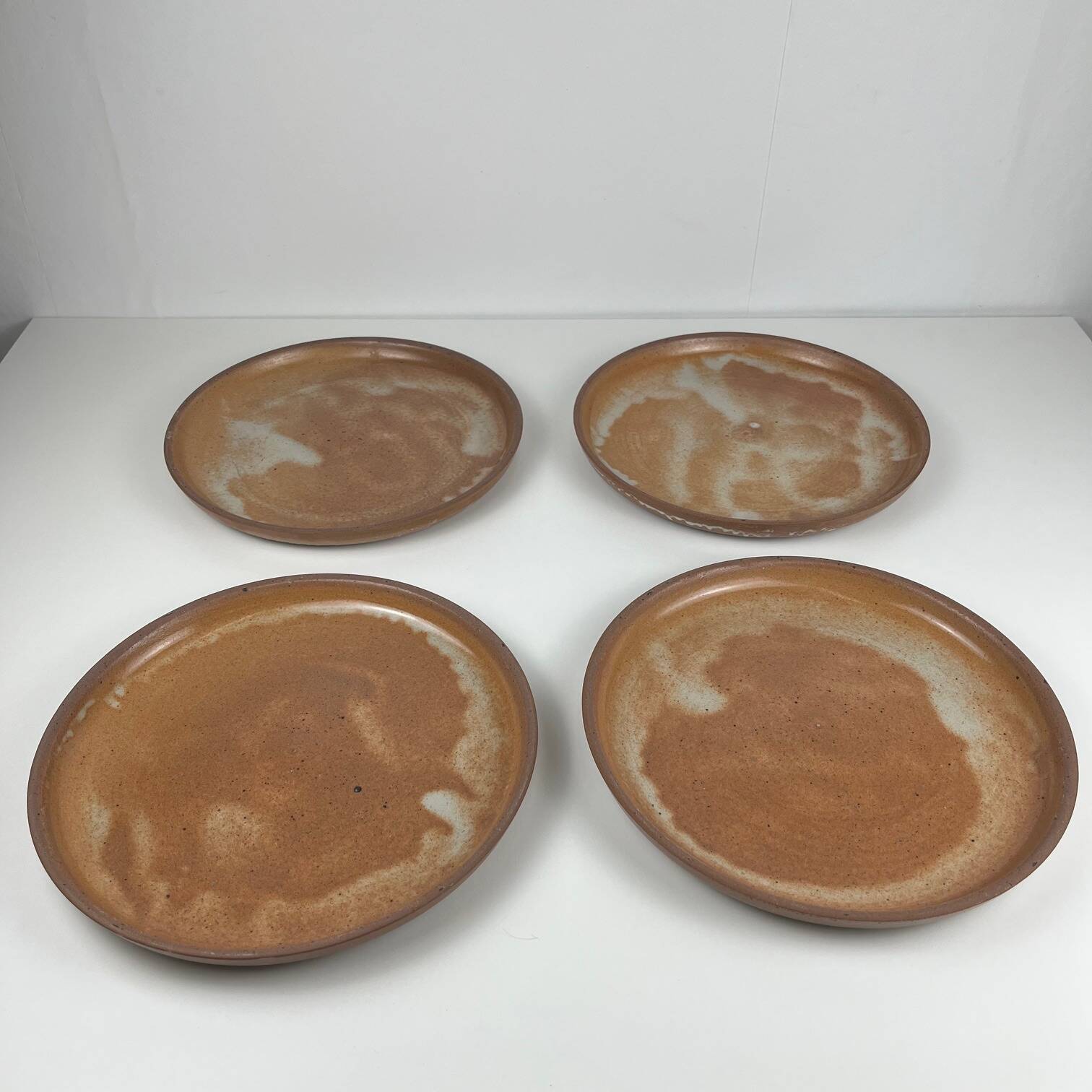 Set of 4 brutalist terracotta plates, brown/red tone, 1970