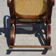 Vintage wooden rocking chair with caning