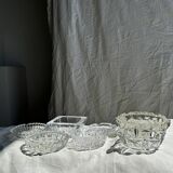 Circular glass ashtray with stylized petal patterns