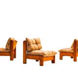 Low armchair in pine wood with bronze fabric