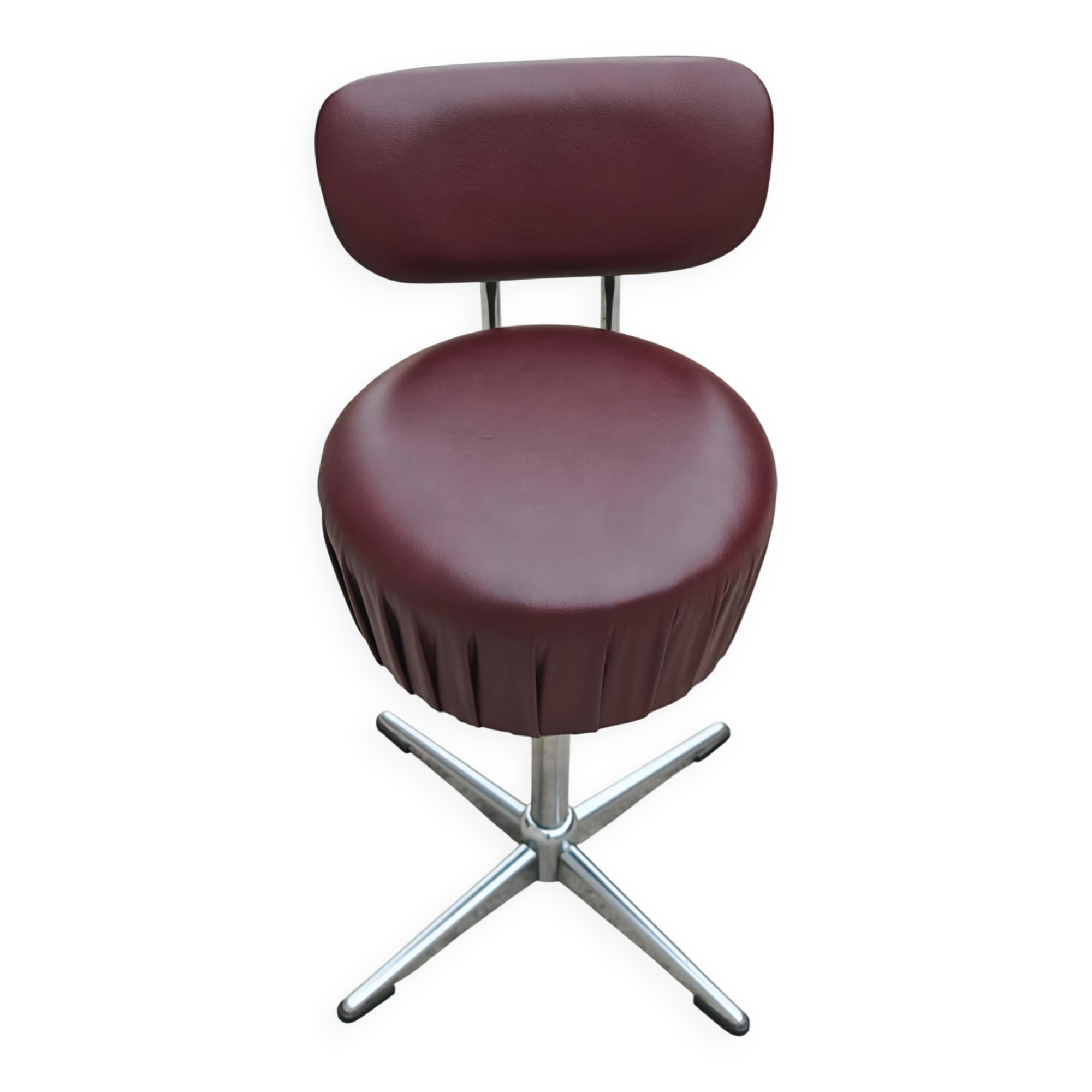 Set of 4 Mid Century Modern swivel chairs in tubular steel and leather.