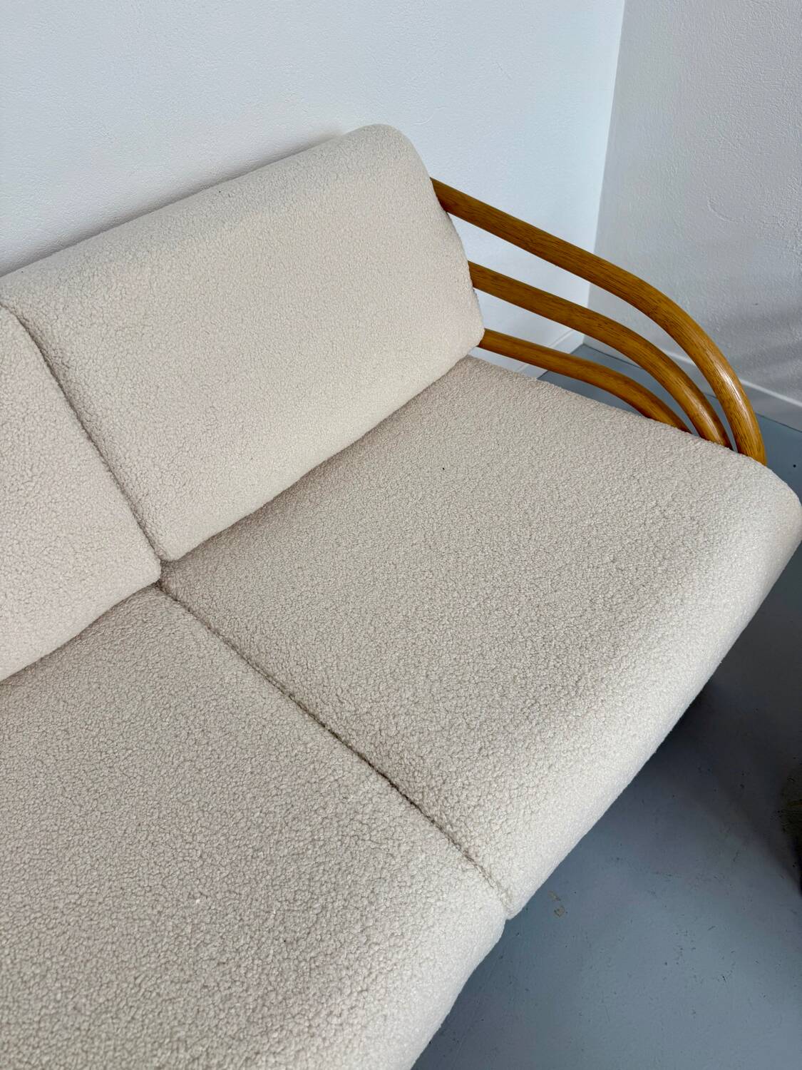 Complete living room with rattan sofa and white bouclette, brass finish, 80's design