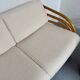 Complete living room with rattan sofa and white bouclette, brass finish, 80's design