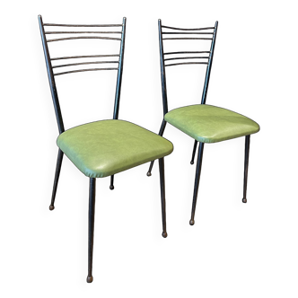 Pair of green vinyl chairs with black steel legs by Colette Gueden