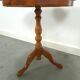 Round vintage wooden side table with inlaid veneer