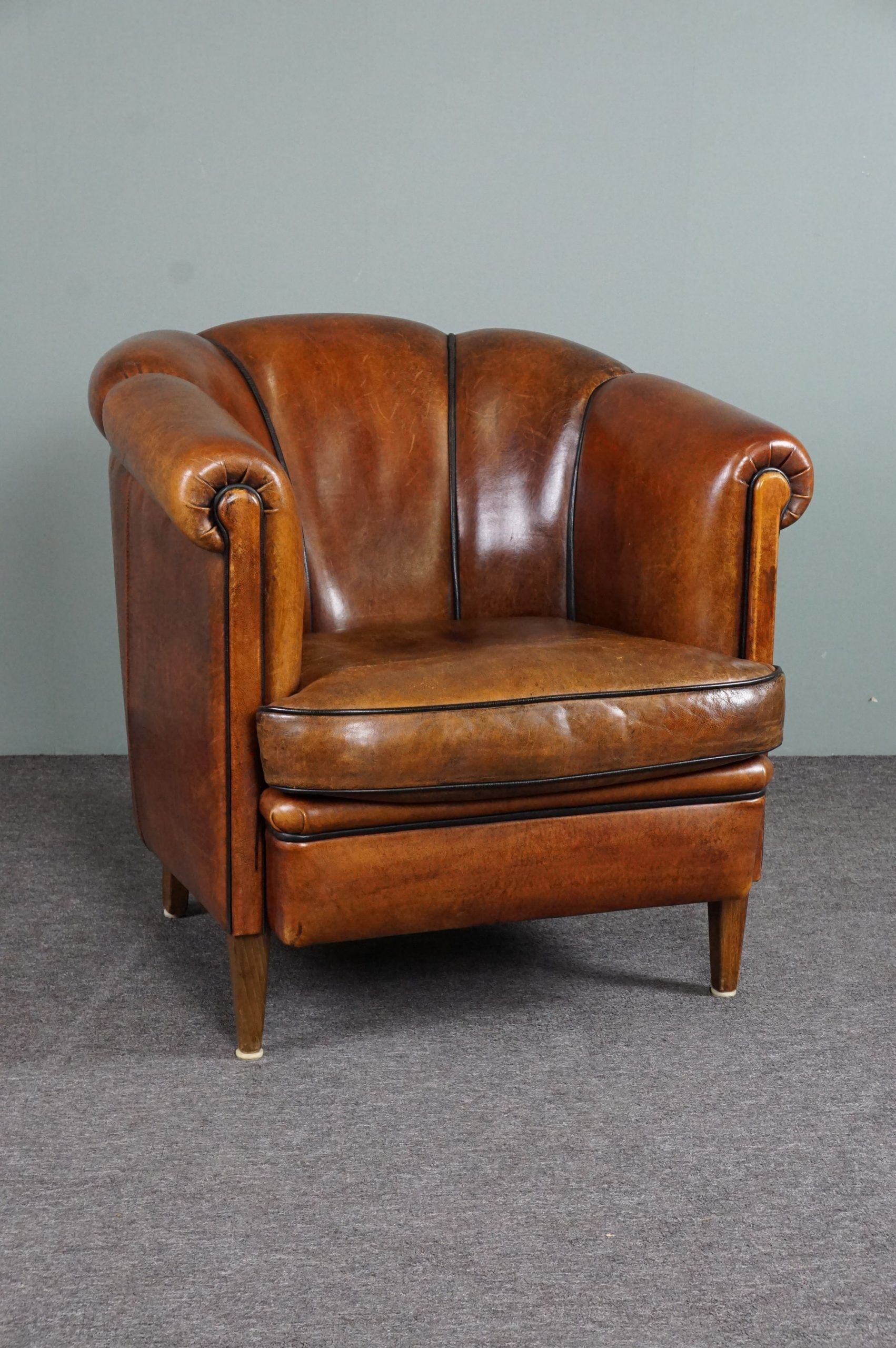 Club armchair in warm coloured sheepskin