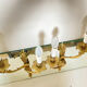 St Louis XV wall lights in solid gilded bronze with curved branches.