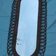 Oval mirror in rattan