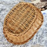 Vintage oval woven wicker basket with thick braided edge