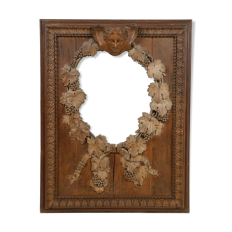 Mirror of the nineteenth century in carved wood