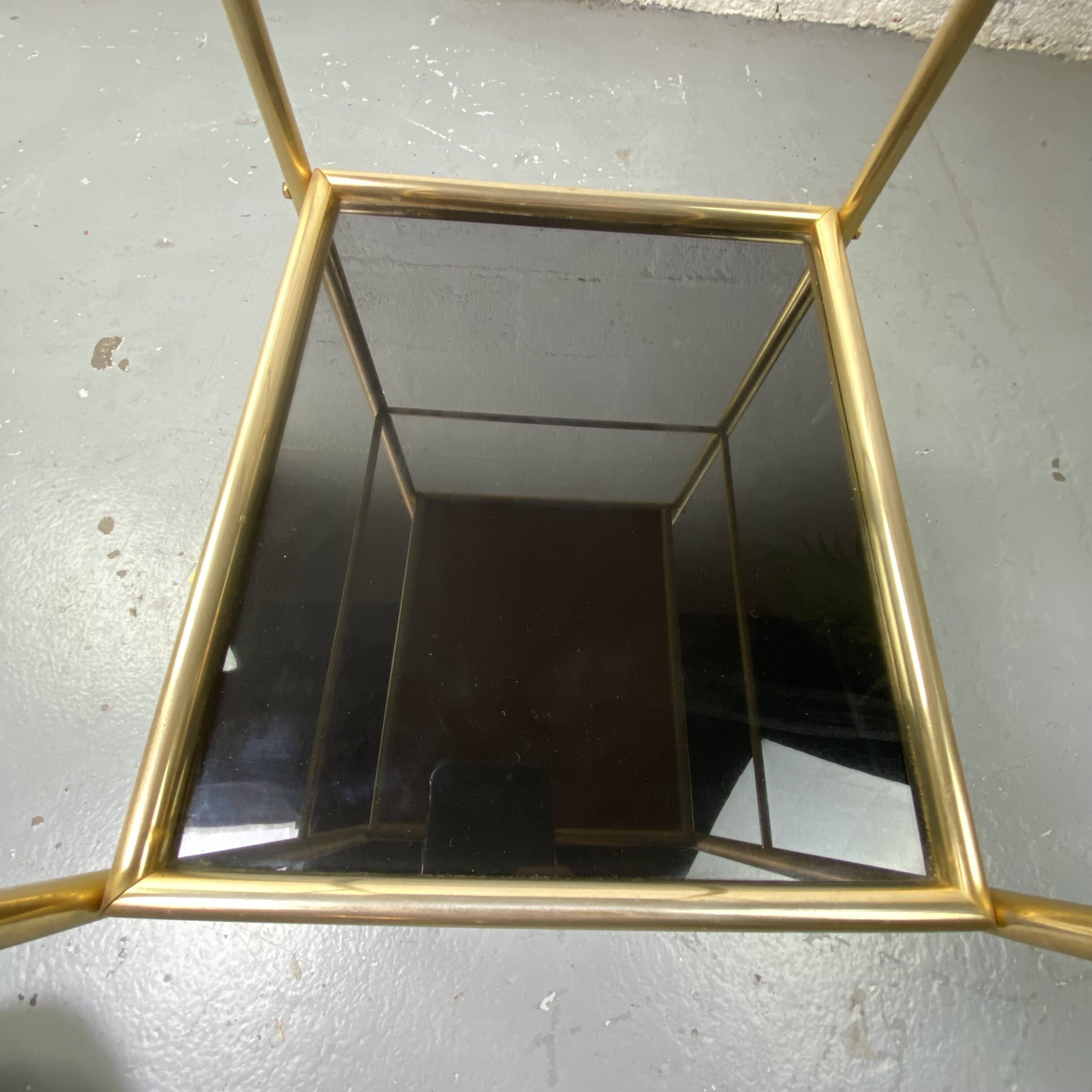 Small rolling trolley in brass and black plastic