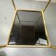 Small rolling trolley in brass and black plastic