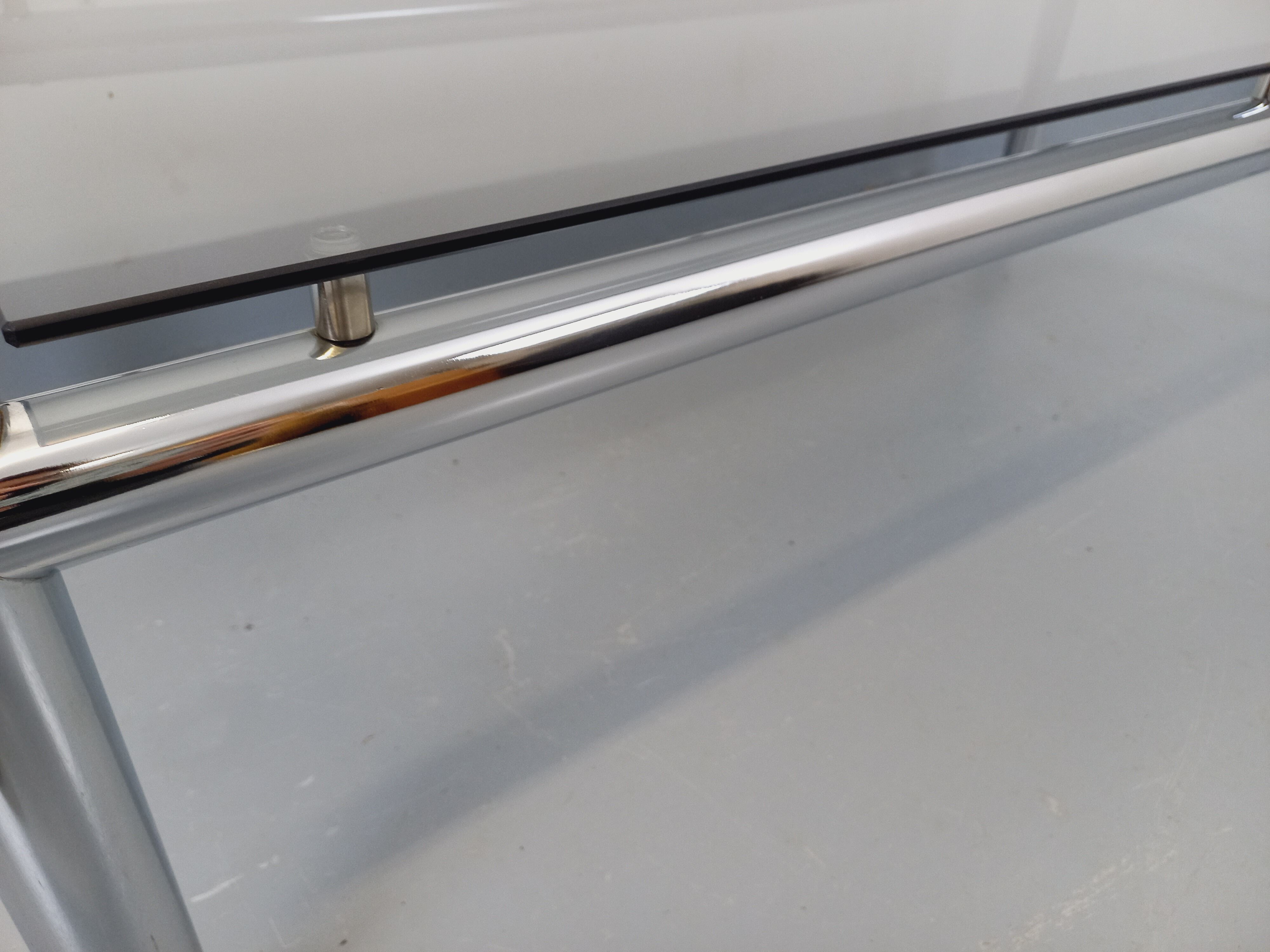 Vintage rectangular coffee table in smoked glass and chrome metal from the 1960s.