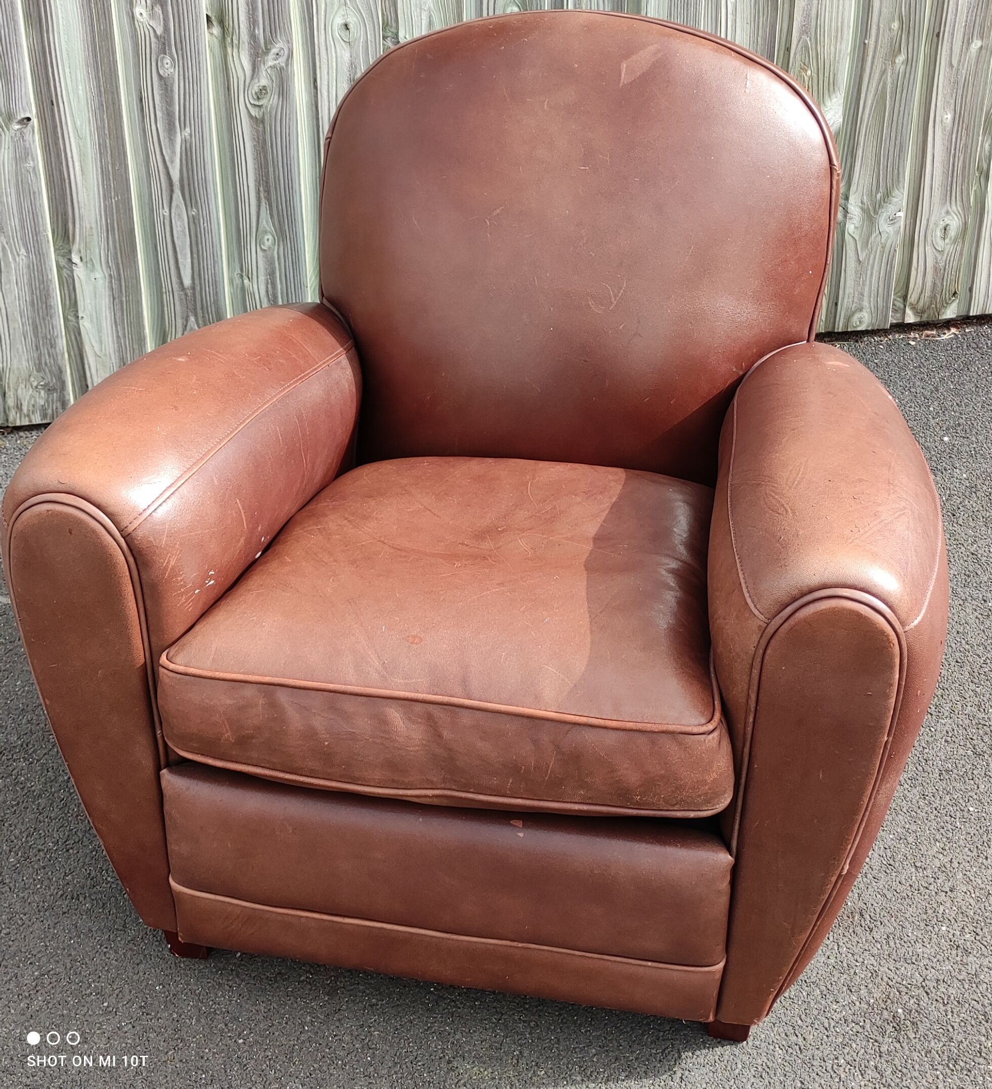 Club chair in brown leather