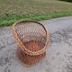 Old throne basket armchair in woven wicker