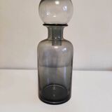 gray glass carafe with stopper