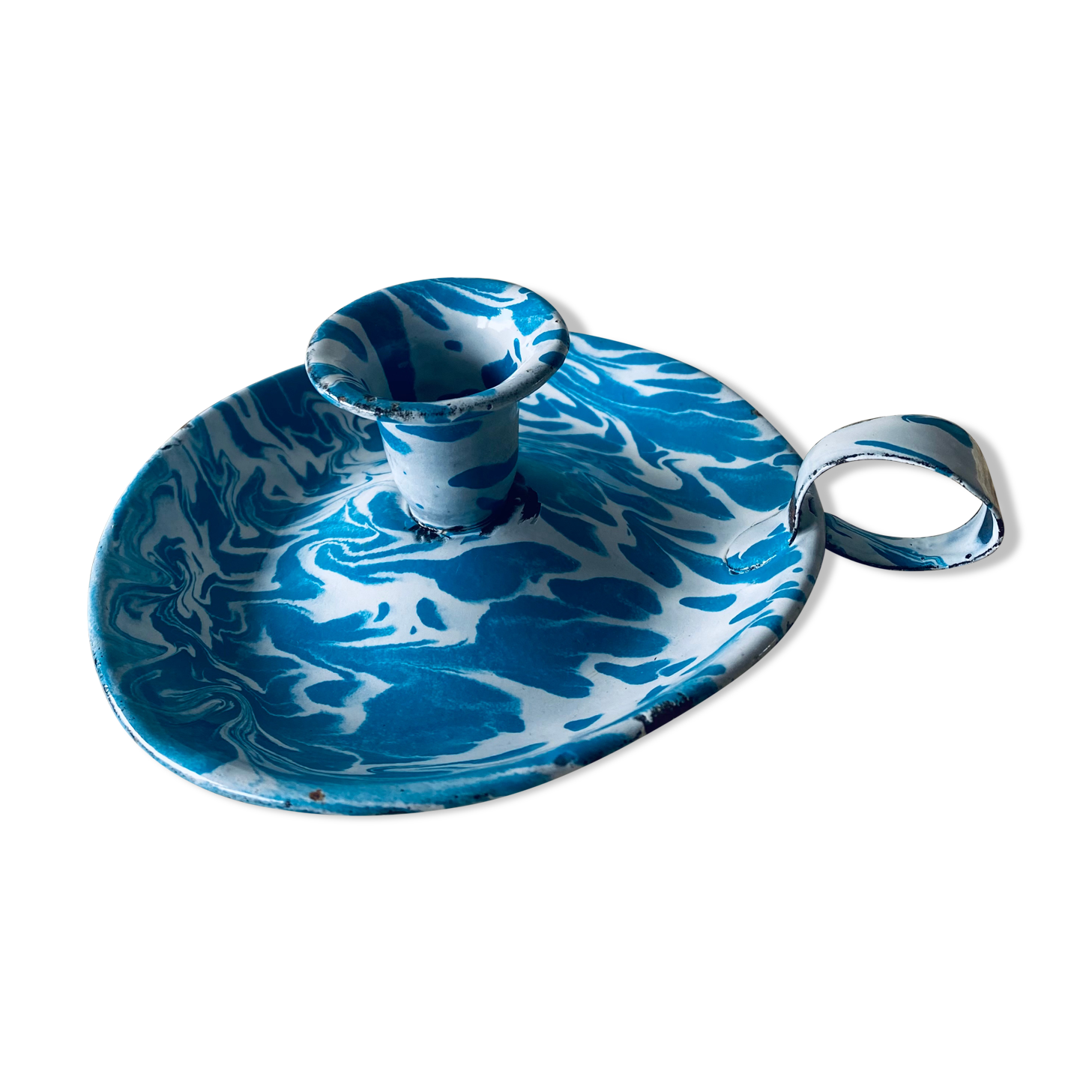 Old enamelled metal candlestick