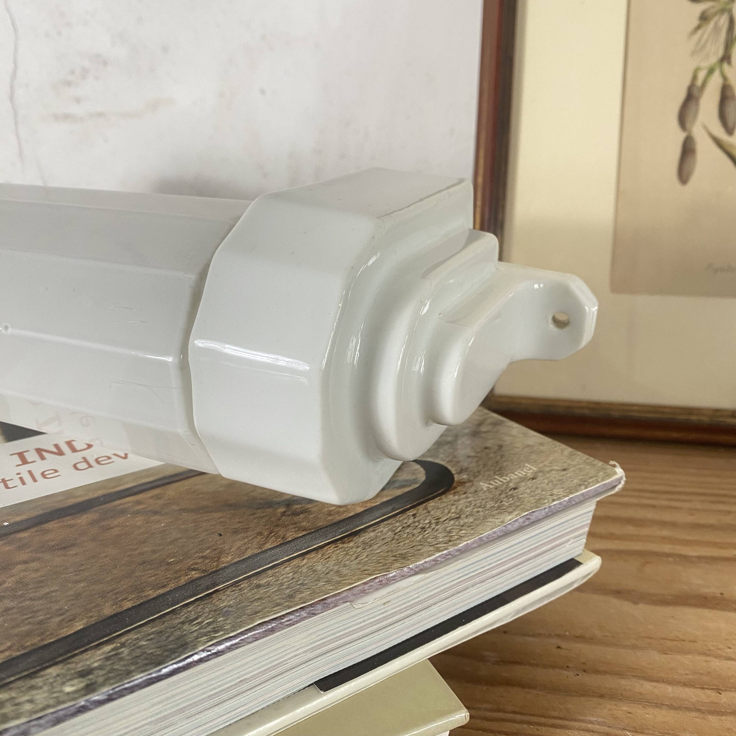 Art Deco tubular wall light in ceramic and white opaline glass tube.