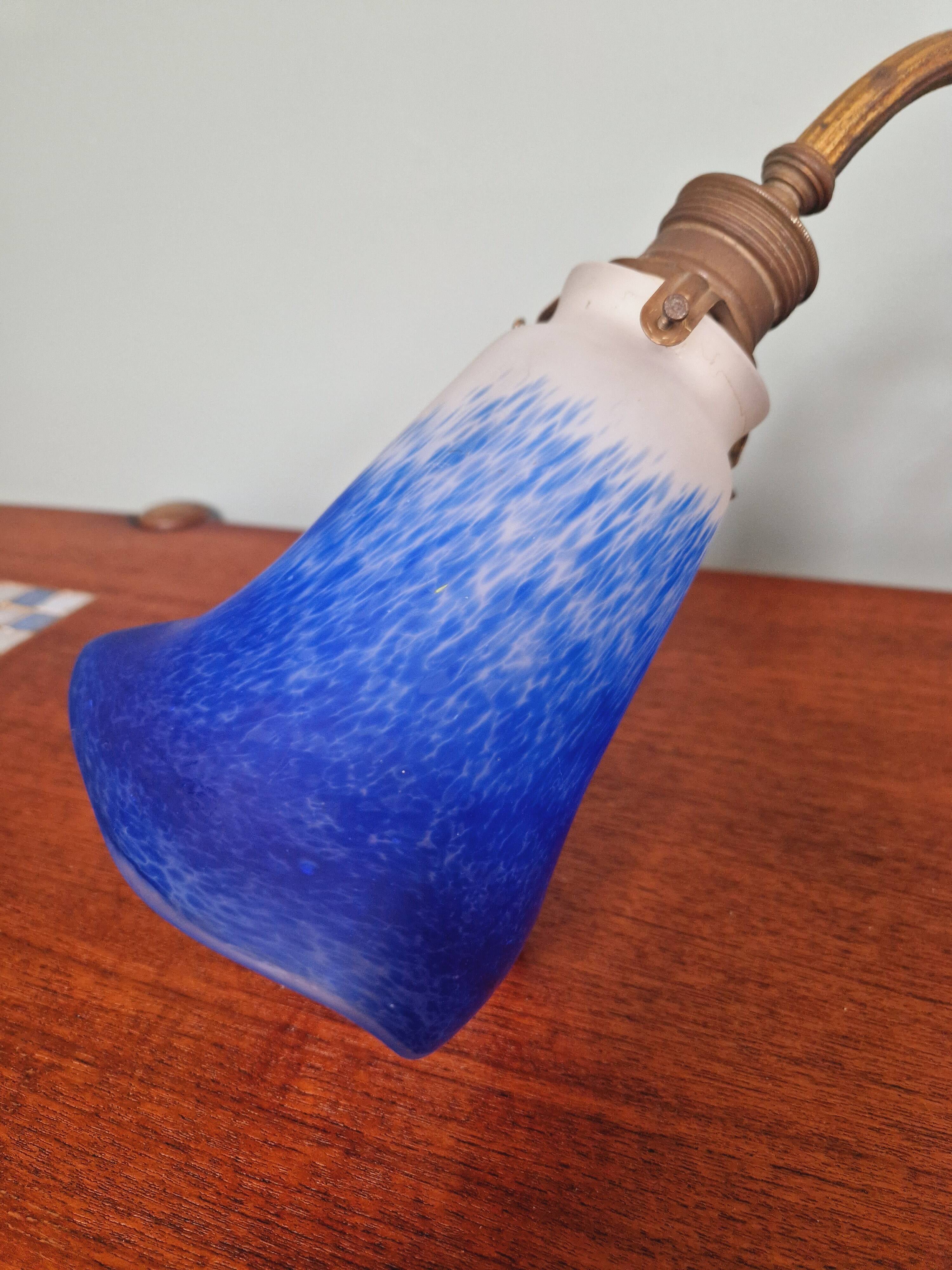 Wall light in gilded bronze and blue marmoreal glass, early 20th century