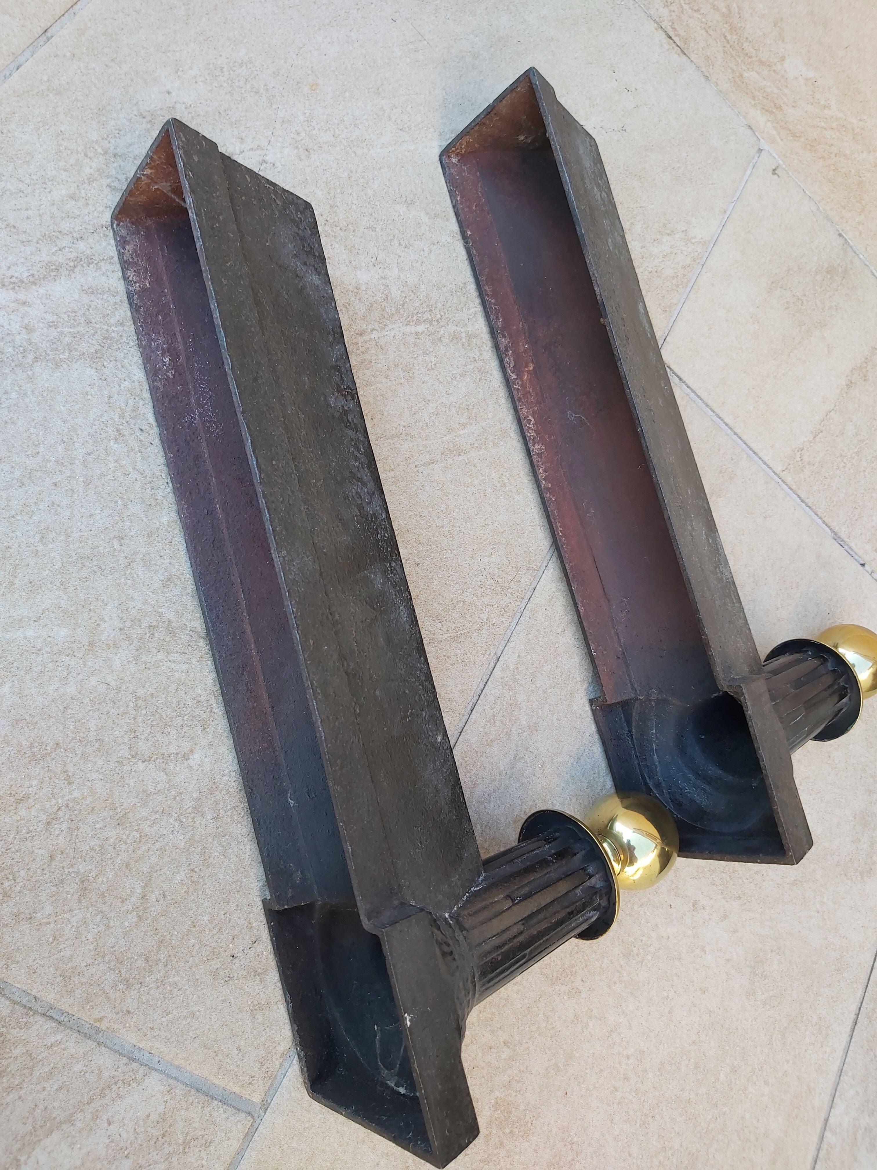 Pair of cast iron and bronze chenets