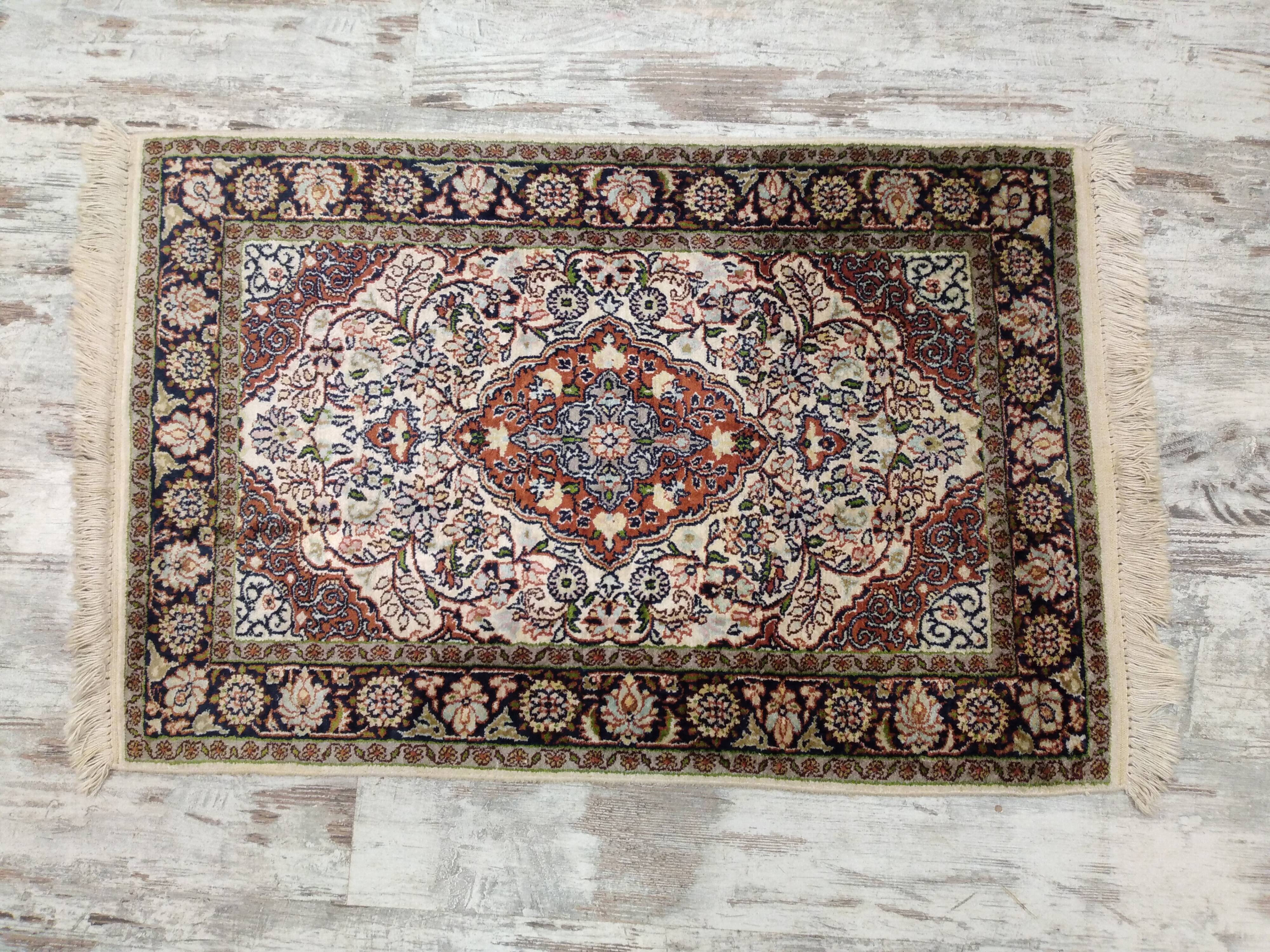 Handmade Persian wool and silk rug