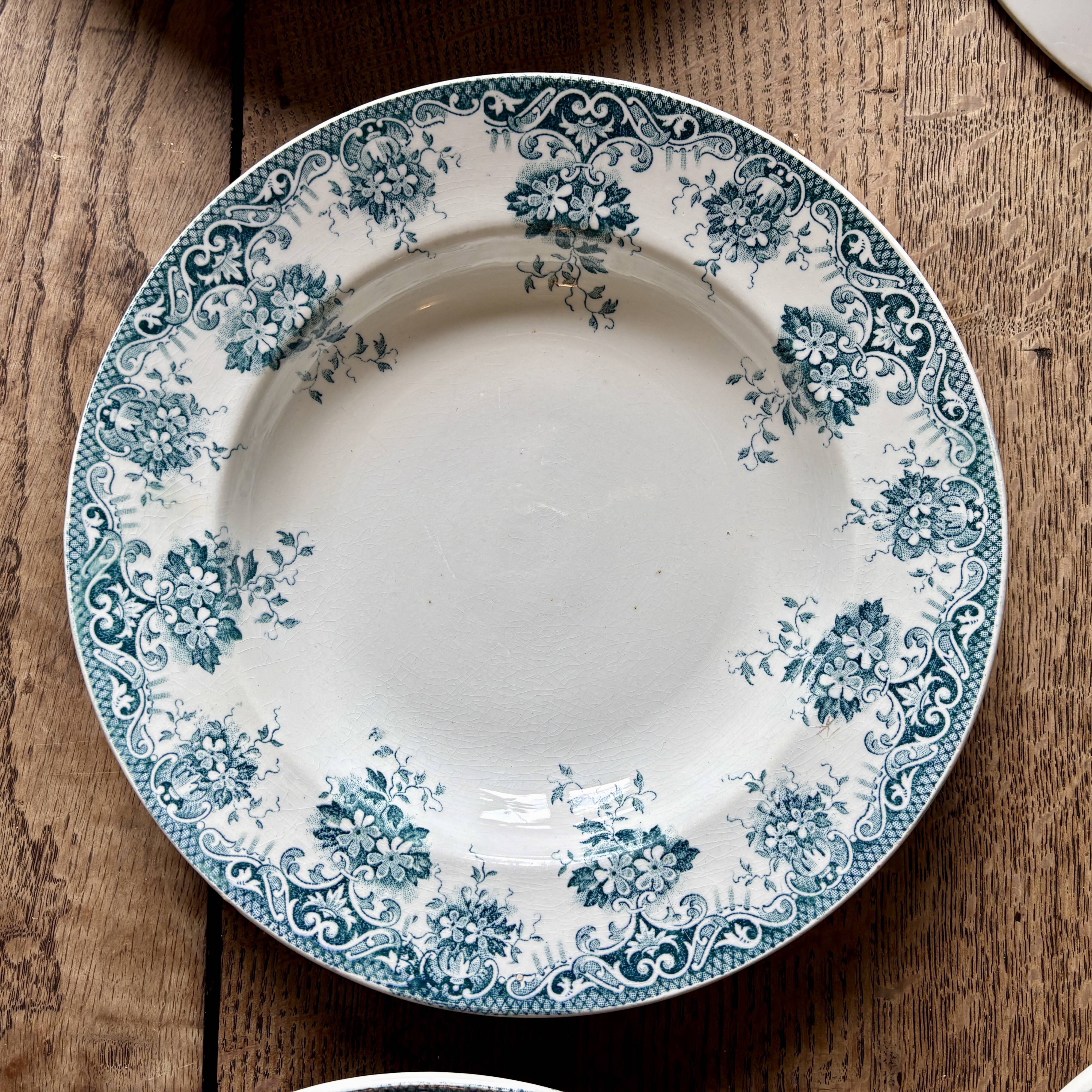 Set of 8 mismatched antique ironstone deep plates.