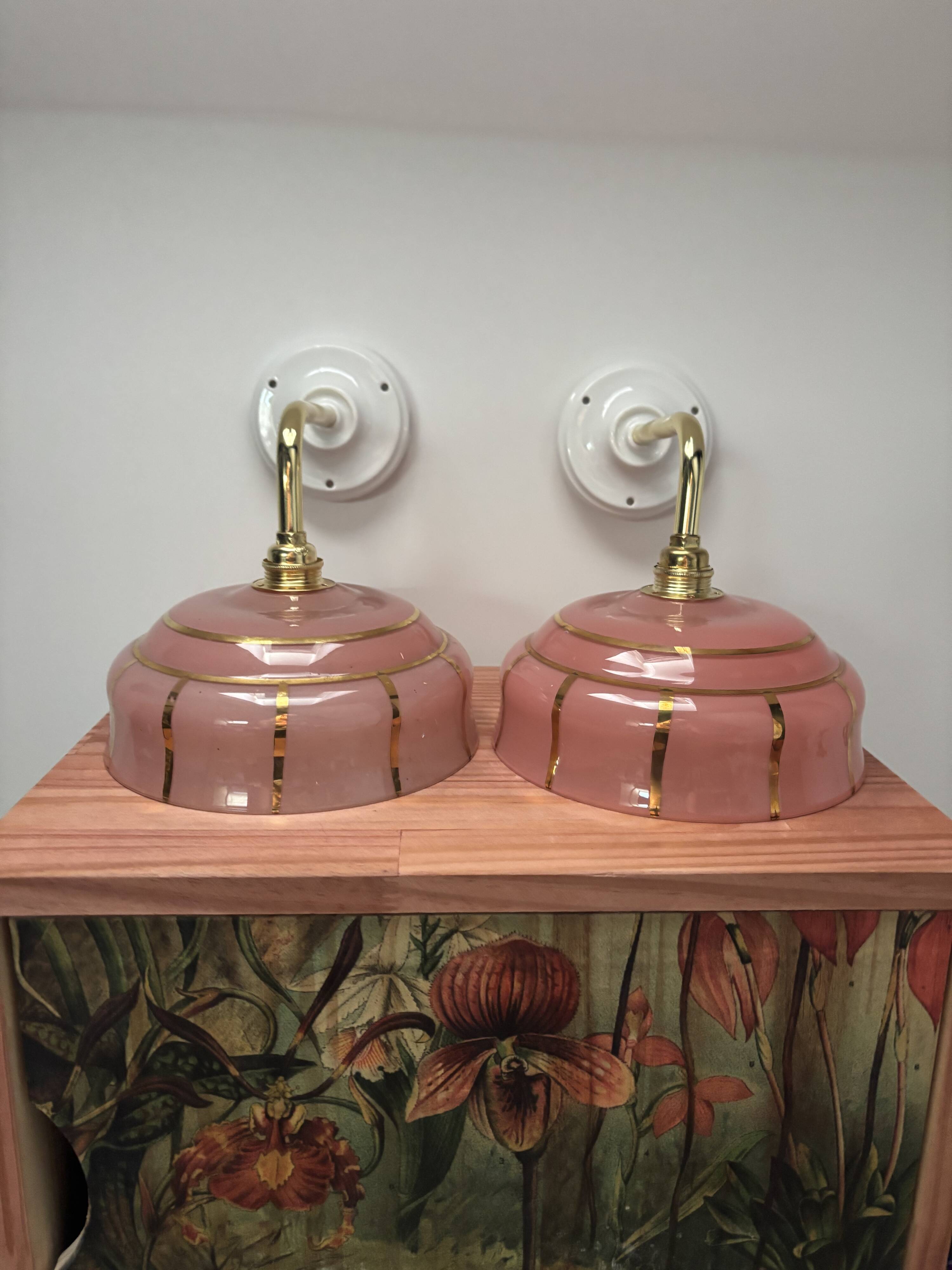 Pair of white ceramic wall lights with pink glass