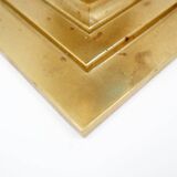 Pair of brass candlesticks decorated with a blue stone inlaid in the center