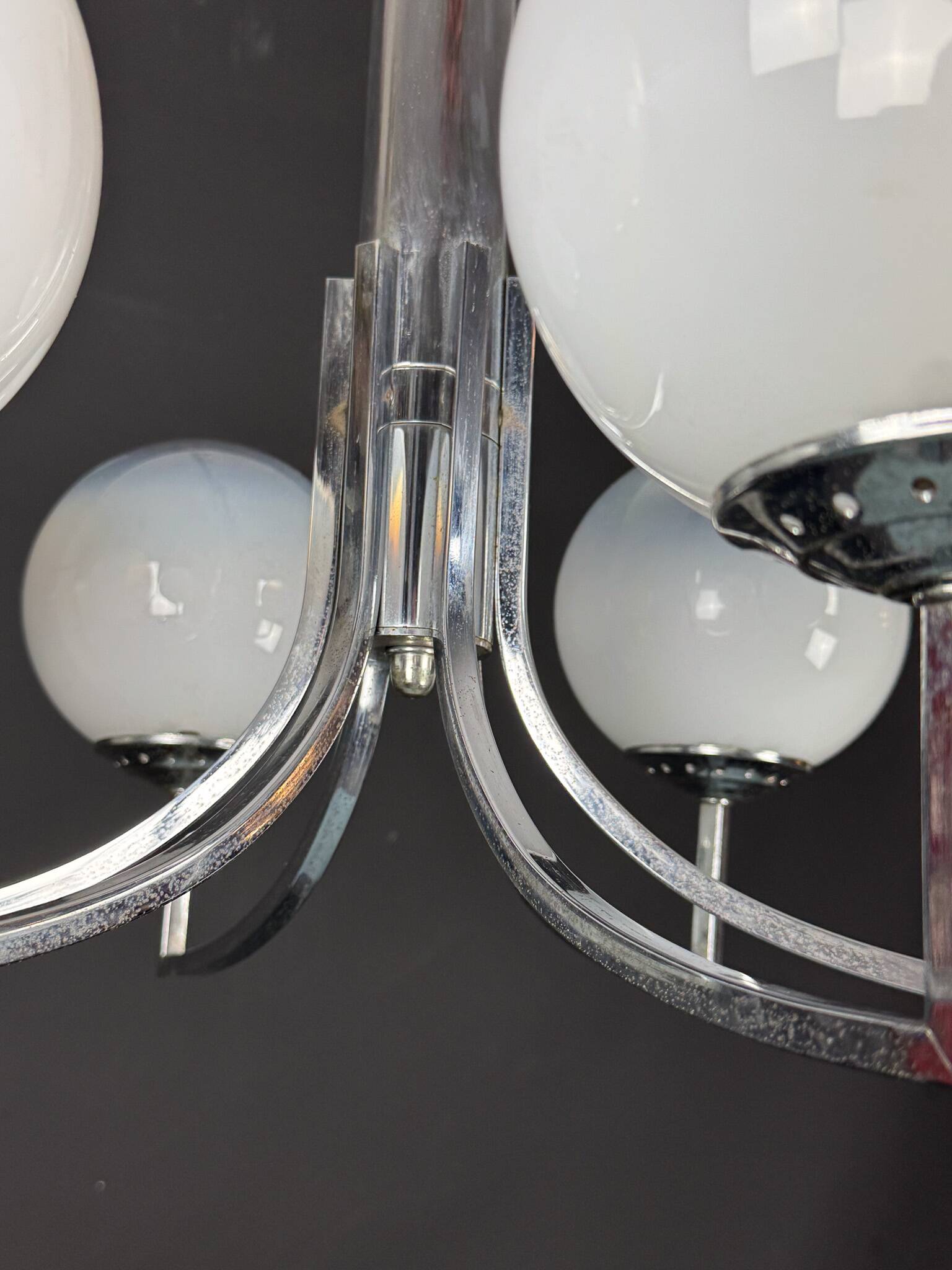 Six arms chandelier in murano glass spheres and chrome. Italy 1960s