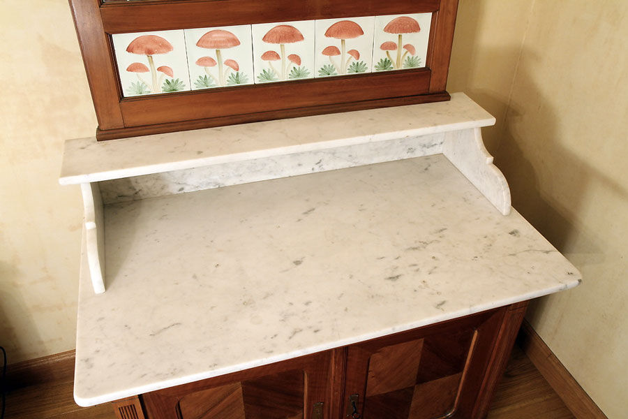 Vintage vanity toilet furniture with marble top.