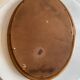 Vintage oval rattan mirror