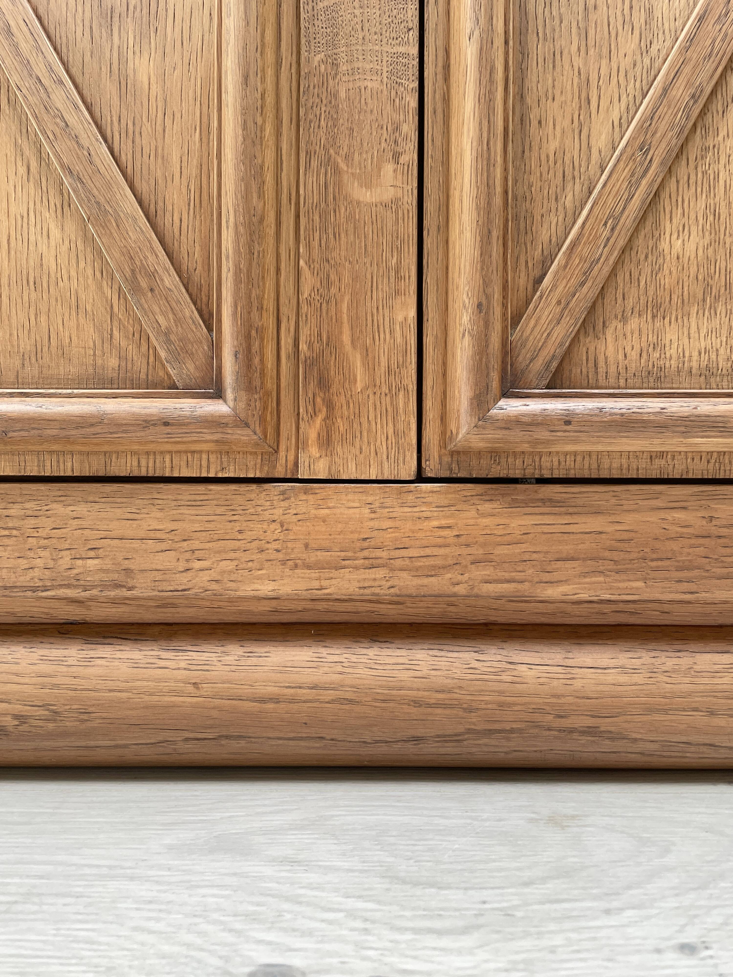 Storage unit in solid oak and veneer, circa 1960.