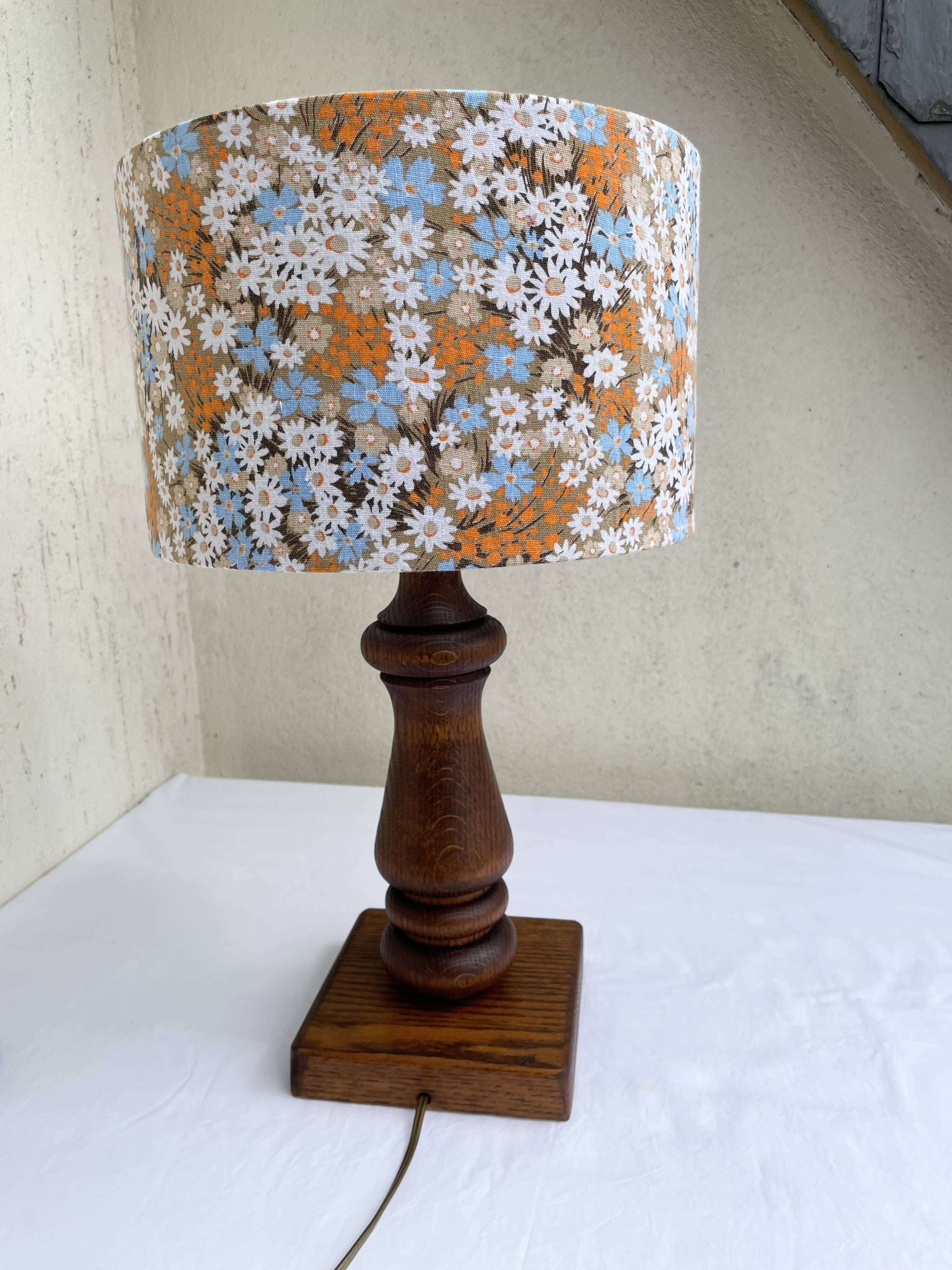 Vintage turned wood table lamp with floral drum shade.
