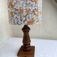 Vintage turned wood table lamp with floral drum shade.
