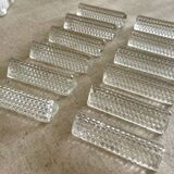 12 portes couteaux en verre.
