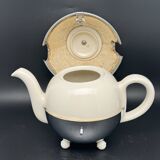 Ceramic and metal teapot with felt insulation