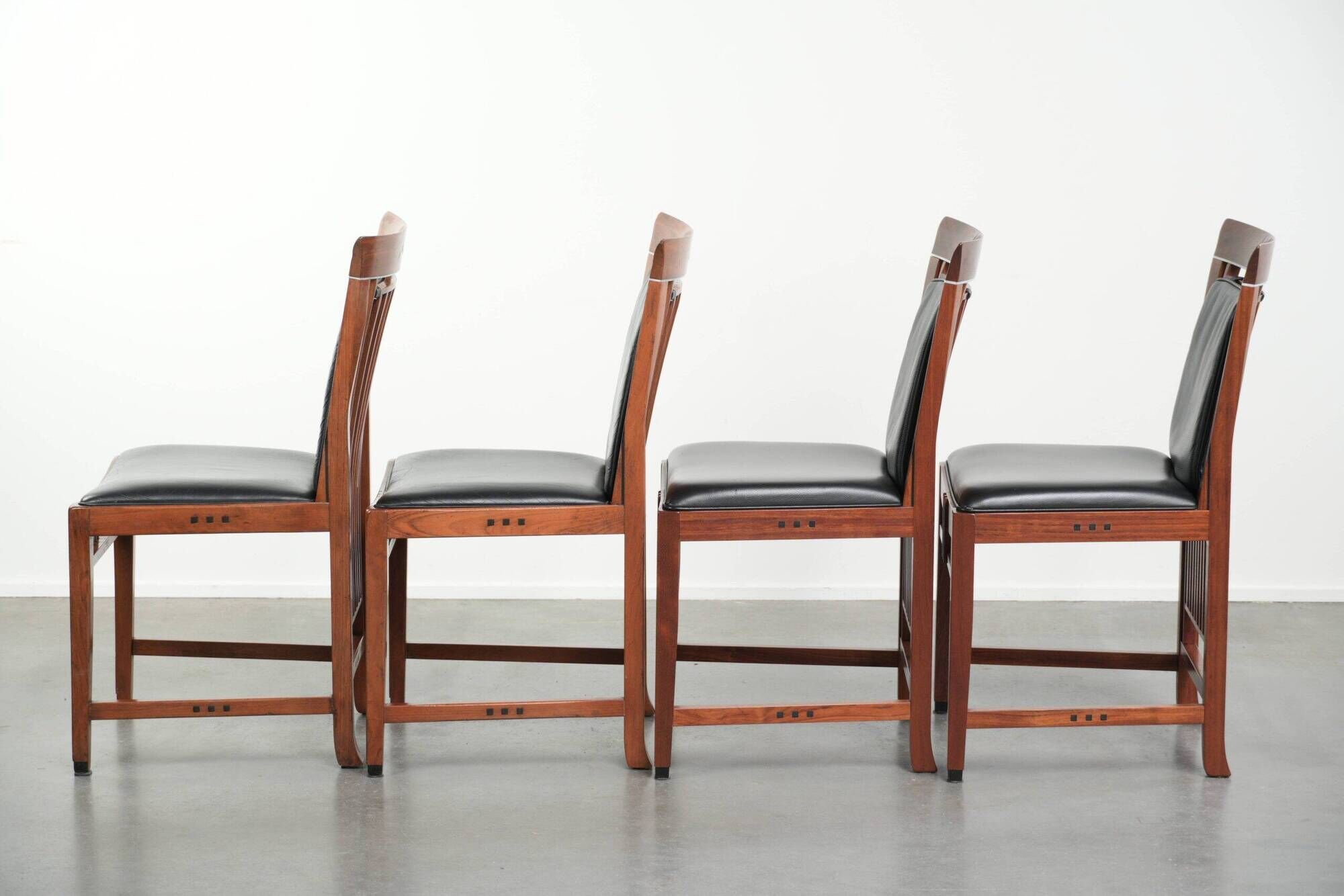 Elegant set of four black cowhide and wooden Art Deco dining chairs