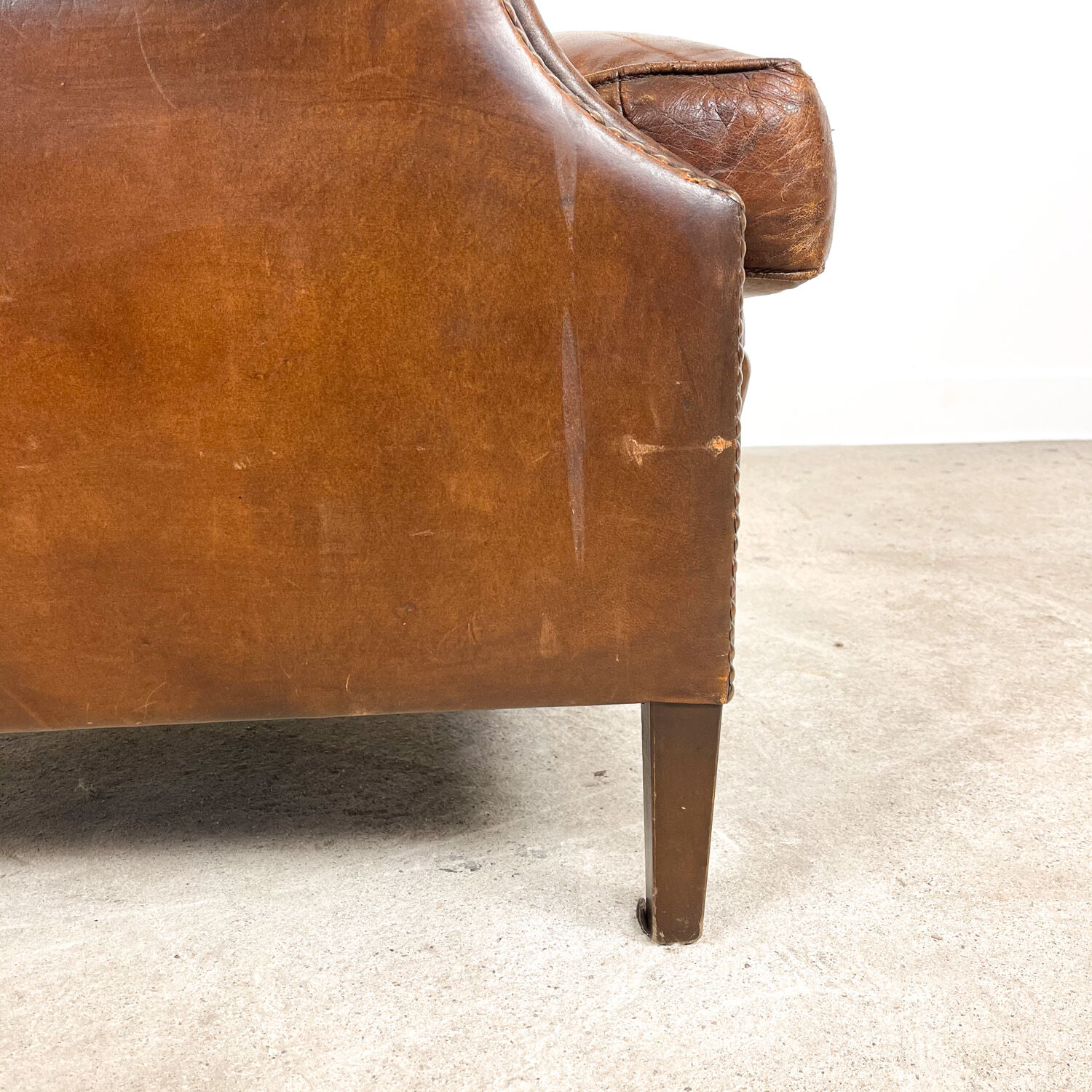 Dark brown sheep leather wingback armchair vintage